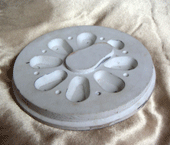 Pattern for driving wheel for a 5 in. gauge Q1 Class locomotive, made from wood and car filler, finished with spray paint.
